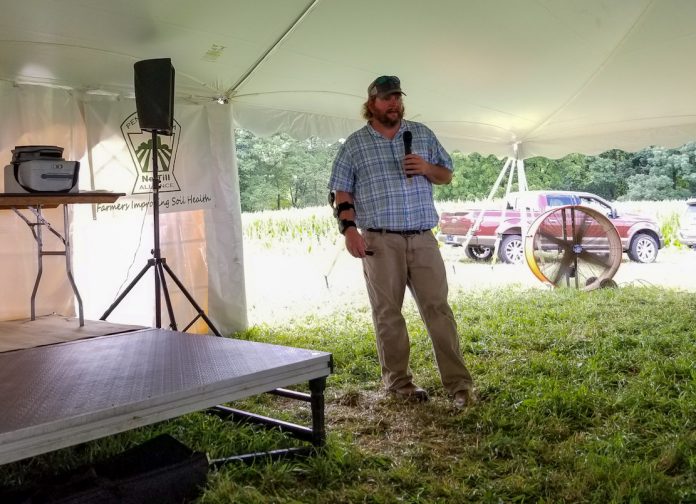no-till-day-2 guy standing in front of crowd