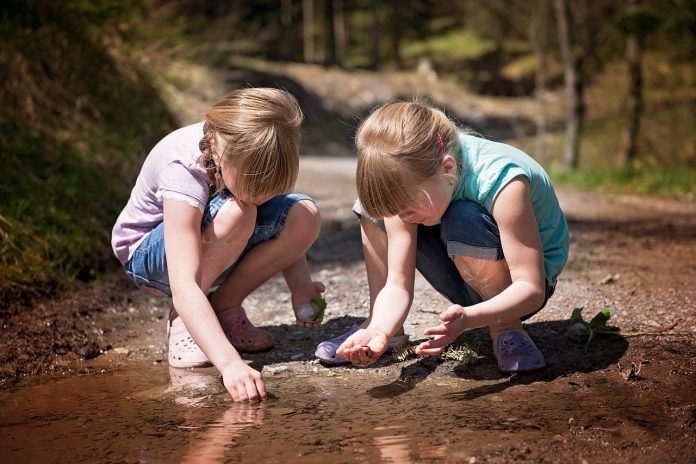 children playing in a stream children playing in a stream