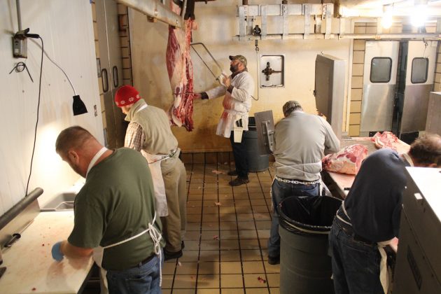workers in a butcher shop