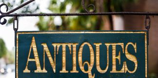 A sign reading "antiques."