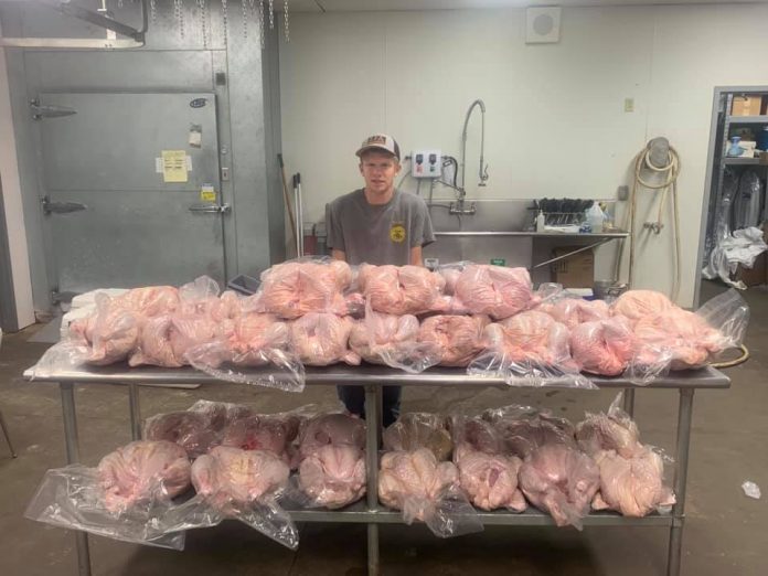 creed ammons turkey guy with table full of turkeys