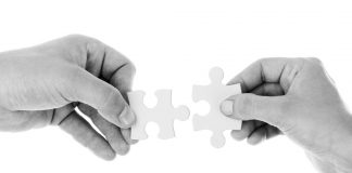 hands with puzzle