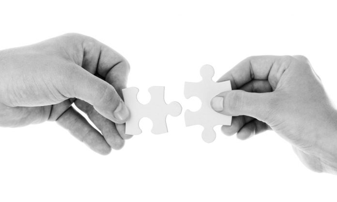 hands-20333_1920_edited hands with puzzle
