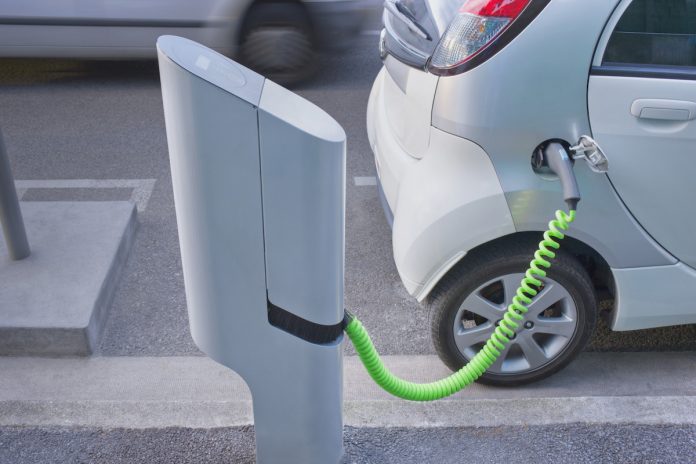electric car electric car plugged into a charger
