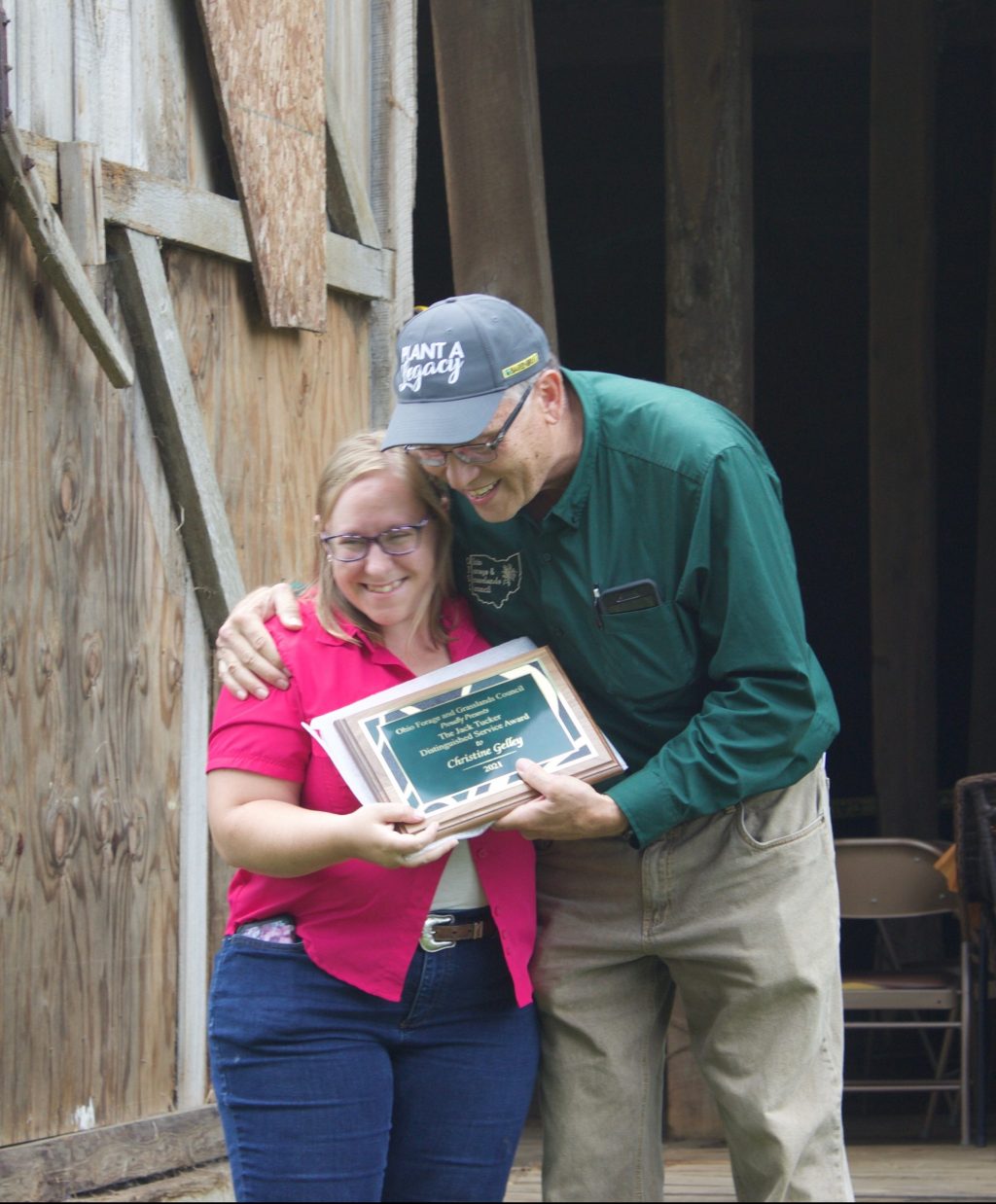 Gary Wilson presents an award to Christine Gelley.