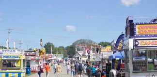 Fairgoers walk around at the Canfield Fair.