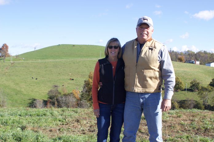 meadow_view_farm_3 Two people stand on a farm.