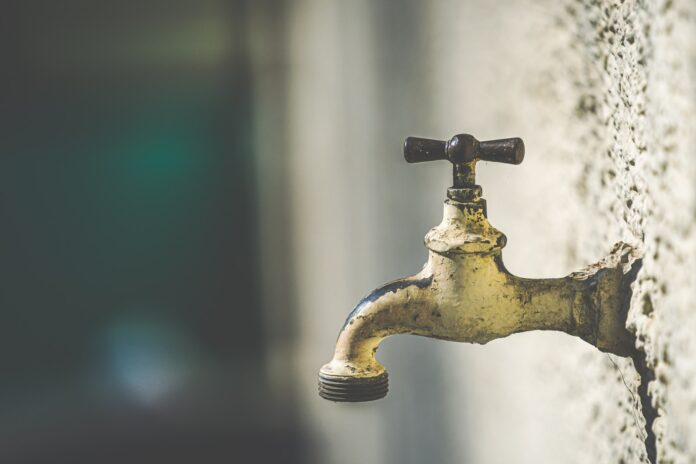 faucet brass faucet with water droplets