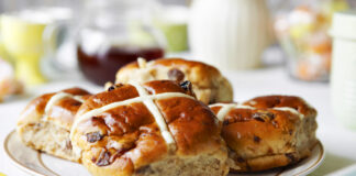 Hot cross buns on a plate.