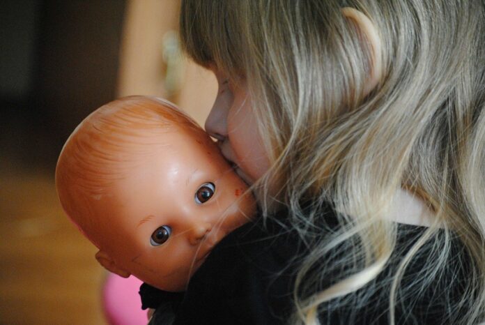 little girl with baby doll little girl with baby doll