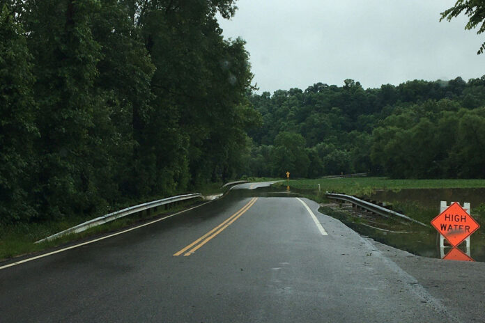 flooding over a road flooding over a road