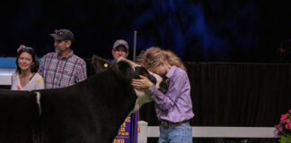 Ryleigh Egbert and her Grand Champion Market Beef Steer