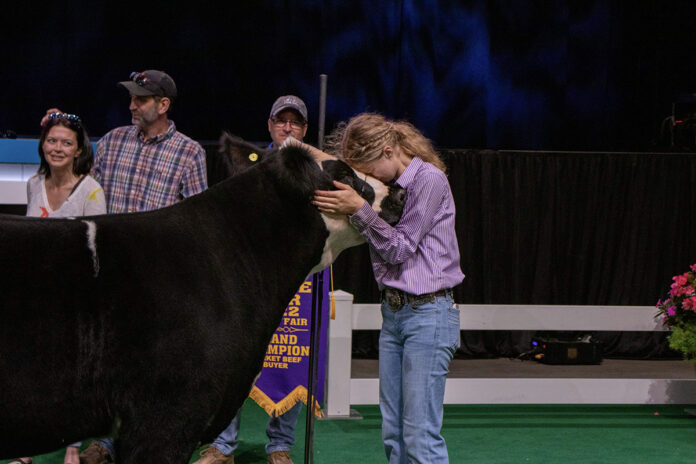 Ryleigh Egbert and her Grand Champion Market Beef Steer