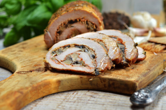 Pork roulade on wooden board