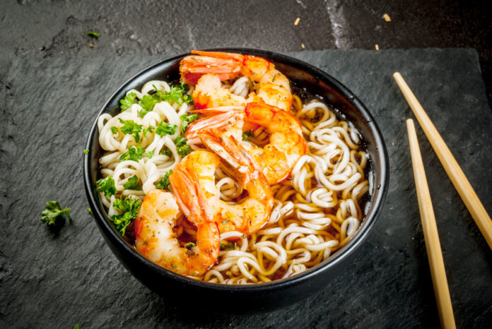 Asian soup with noodles and shrimps prawns