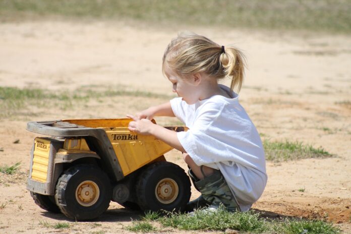 child playing in dirt child playing in dirt