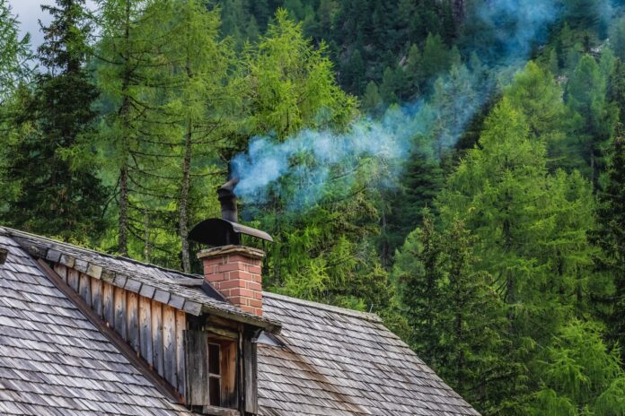 Photo by Sandra Grünewald brown wooden house near green trees during daytime