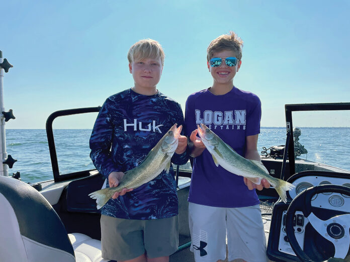 two boys with fish two boys with fish