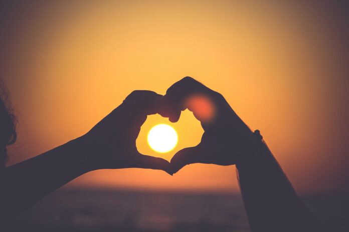 Photo by Mayur Gala silhouette of person's hands forming heart