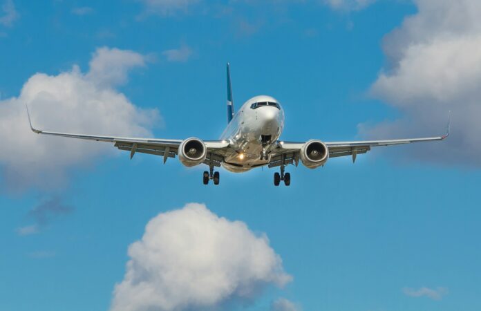 Photo by John McArthur white airplane on mid air