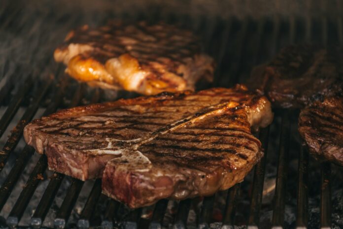 Photo by Hitesh Dewasi grilled meat on black charcoal grill