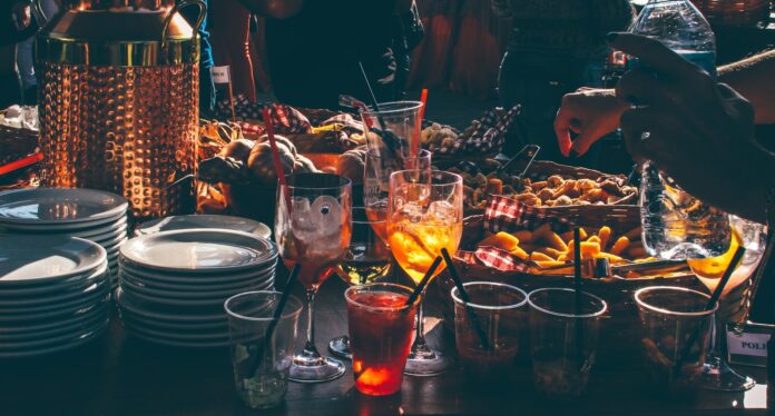 Photo by Vinicius  person trying to pick fried food