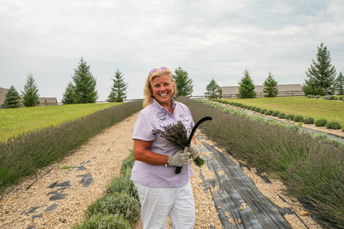 vicki smiling with sickle 2 Lavender Meadows