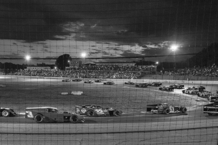 Late models gather for a formation lap at Midvale Speedway.