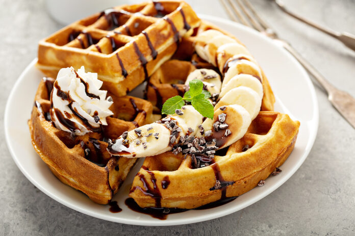 Breakfast waffles with bananas and chocolate